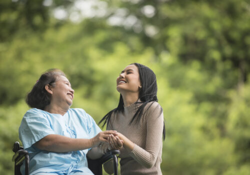 younger lady talking with elderly lady