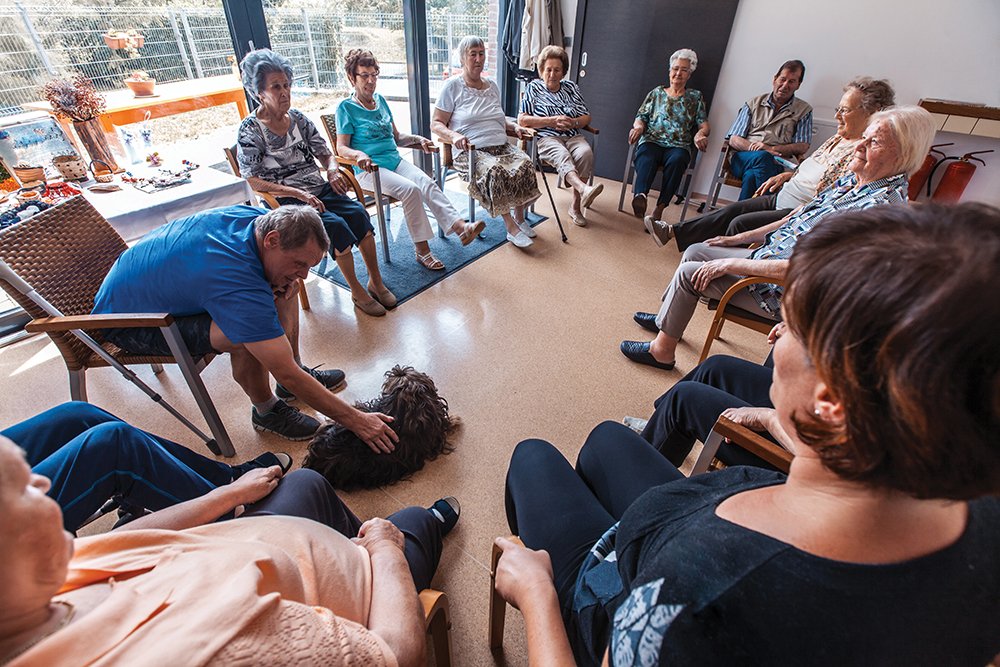 Seniors participating in Group Activities in Adult Daycare Center