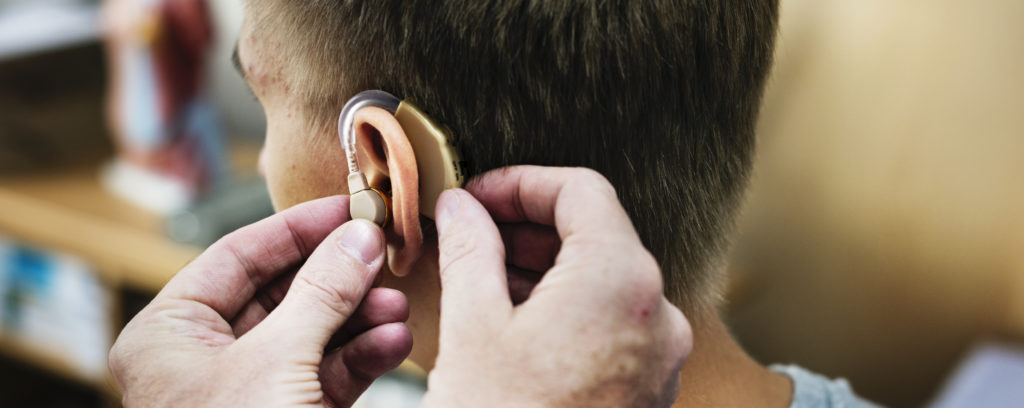 A hearing aid being fitted