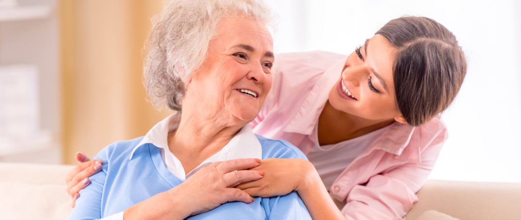 live in carer smiles at older lady