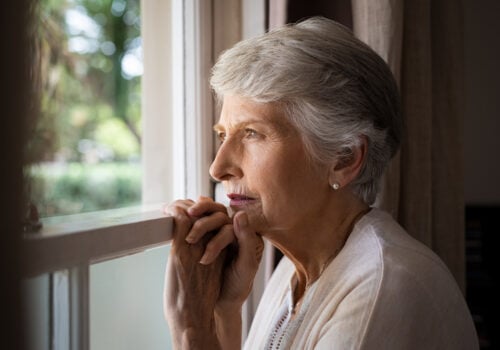 Older lady looking out of window