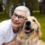 elderly lady hugging her dog