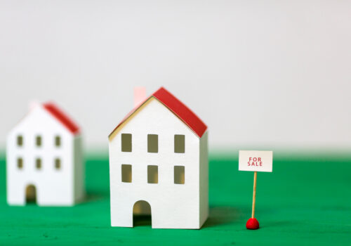 model house with for sale sign