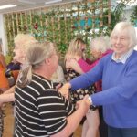 Participants at Old ilk Works Club (dementia day service) dancing