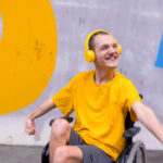 smiling man in wheelchair