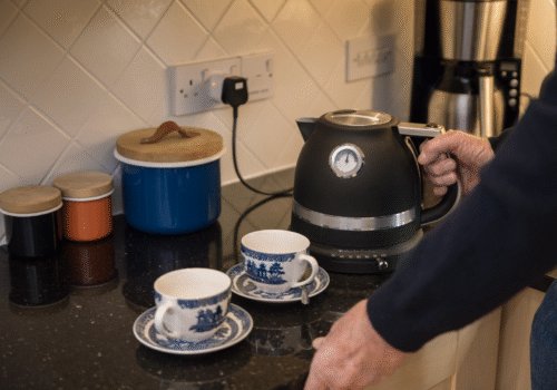 family carer making tea