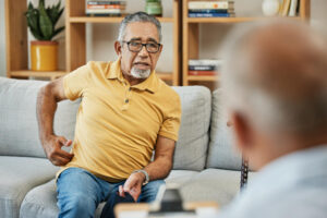 older man speaking to counsellor